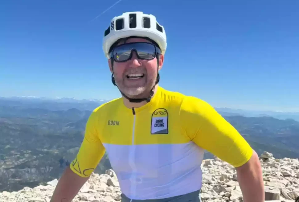 Paul Munn in Borne Cycling jersey on a blue sky day at the top of Mont Ventoux
