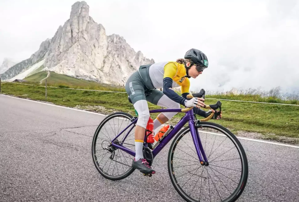 Female cyclist descending safely on a bike