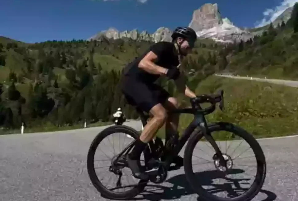 cyclist on a hairpin on passo giau
